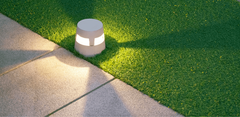 illuminated led lantern on fake grass